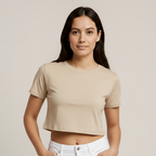 Woman wearing a Beige Crop top against a plain background