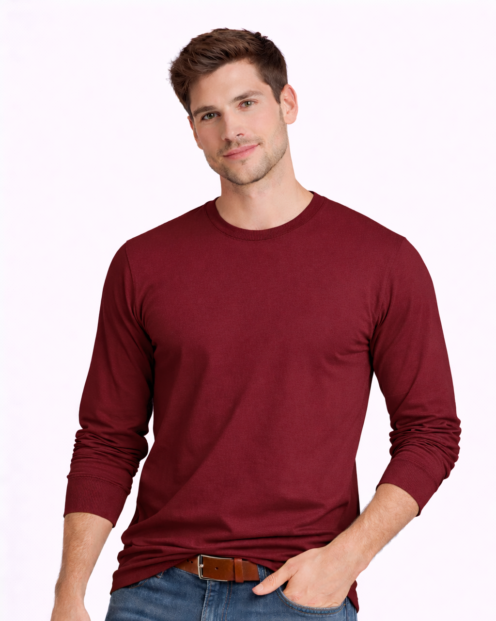 Man wearing a maroon long-sleeve shirt and blue jeans on a white background