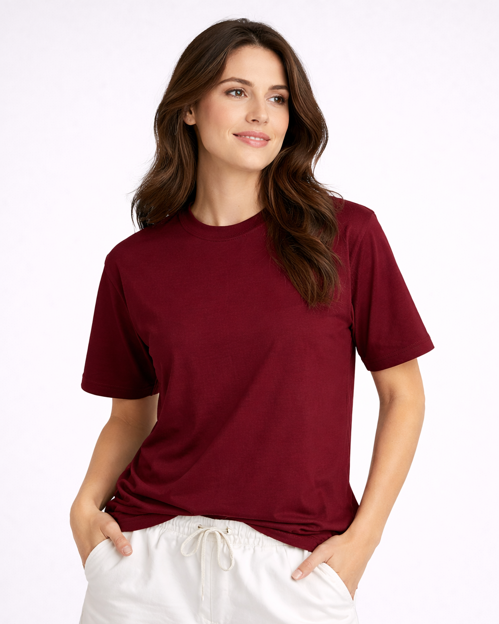 Woman wearing a maroon t-shirt and white shorts on a white background