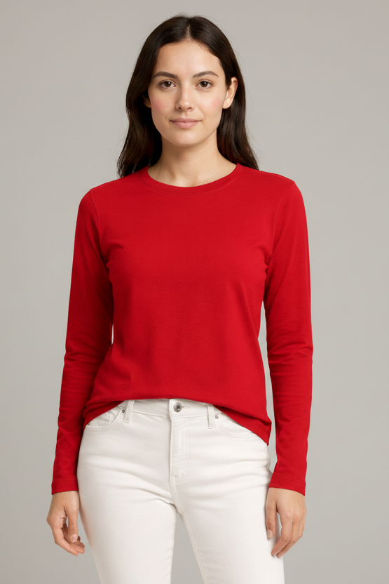 Woman wearing a red long-sleeve top and white pants on a beige background