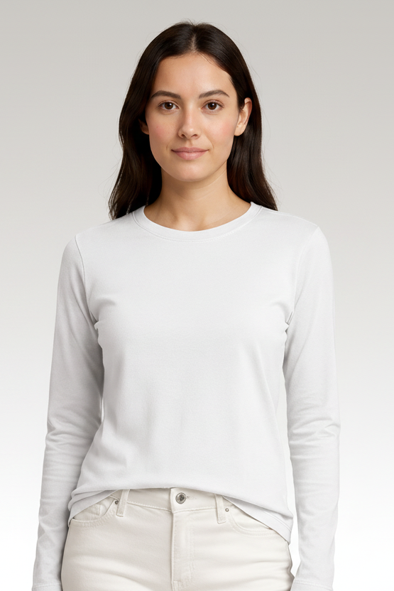 Woman wearing a light gray long-sleeve shirt and white pants against a beige background